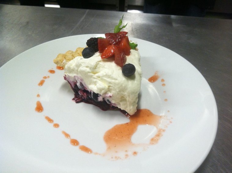 Wild Berry Pie filled with fresh blueberries and blackberries, topped with whipped cream cheese.  Photo credit: 40 East Grill.
