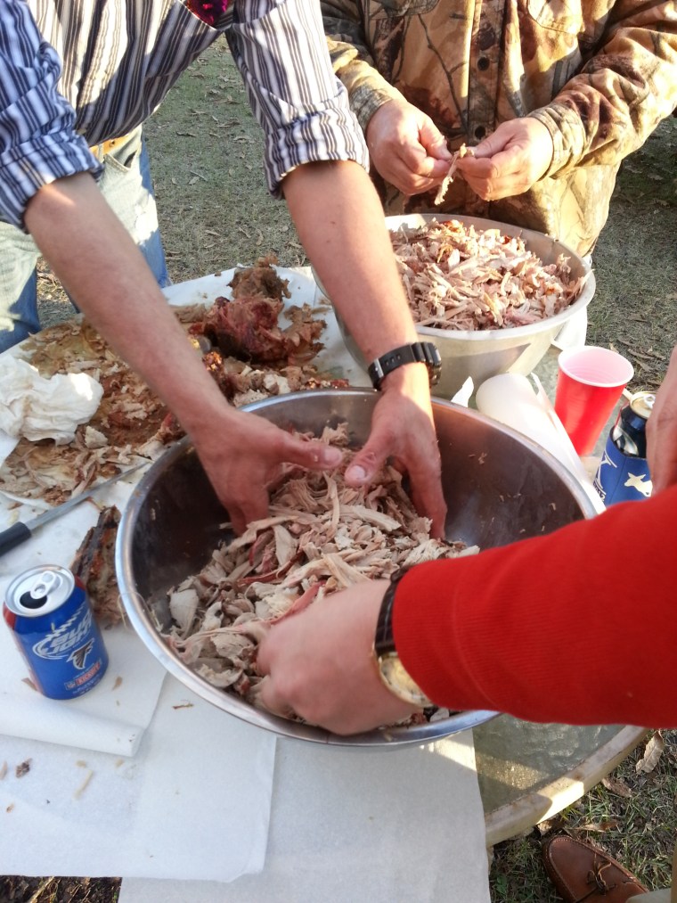 The meat is fall-off-the-bone tender after slow roasting all day. 