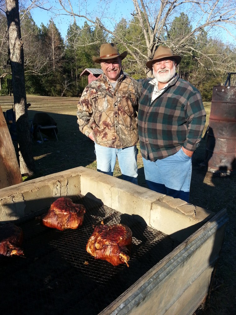 From left: Uncle Norman and Uncle "Bimbo" have been a part of The Cookin' since the day they were born. The age-old fire barrel stands in the background.