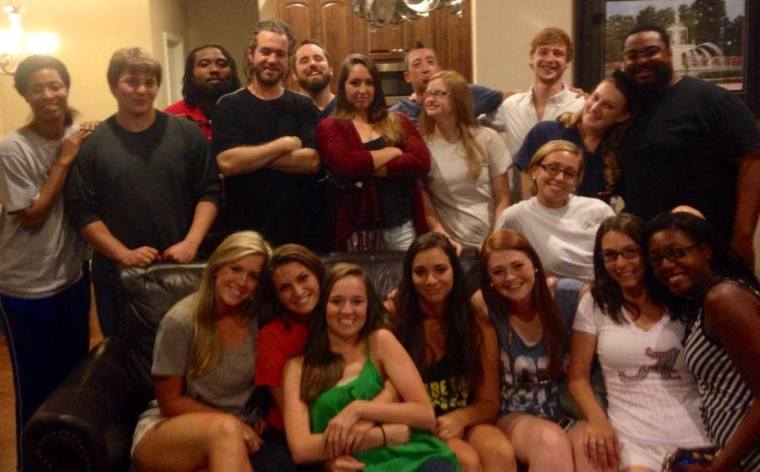 On the night after the fire, the South and Vine staff gathered at Seni and Janetta's home. Seni posted this picture on Facebook with the words, "We'll be back."