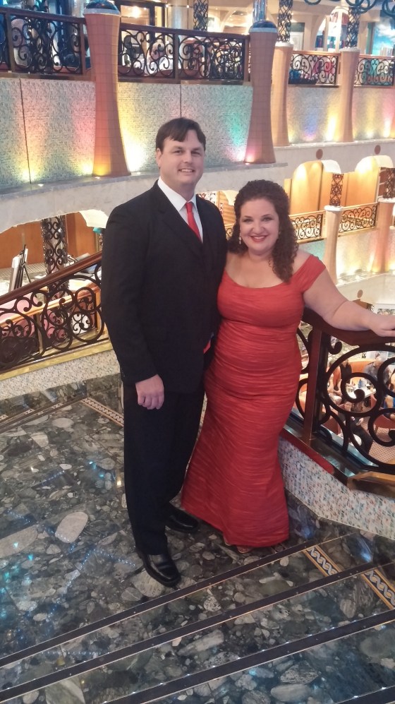Owning the cruise ship in our red elegant evening attire.