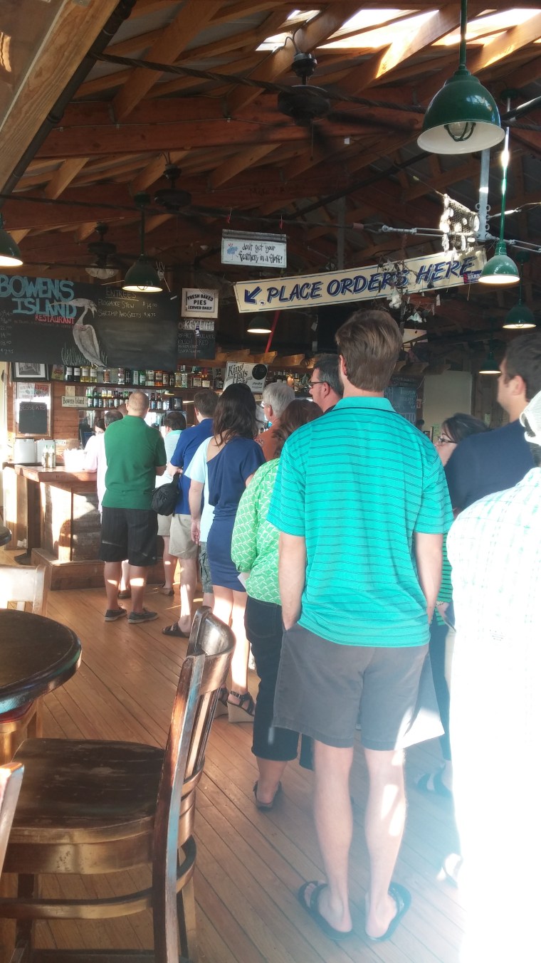 Guests stand in line to place their orders.